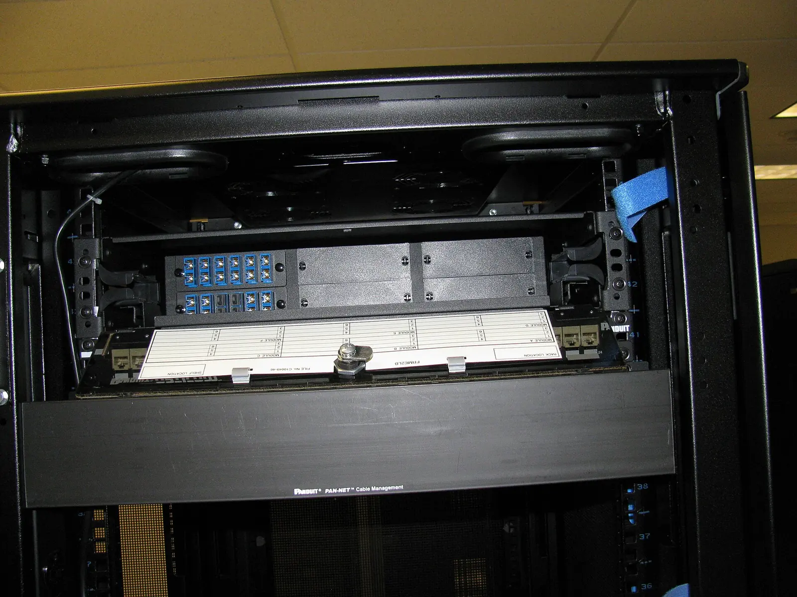 Fibre patch panels and organised connections inside a data-centre network cabinet