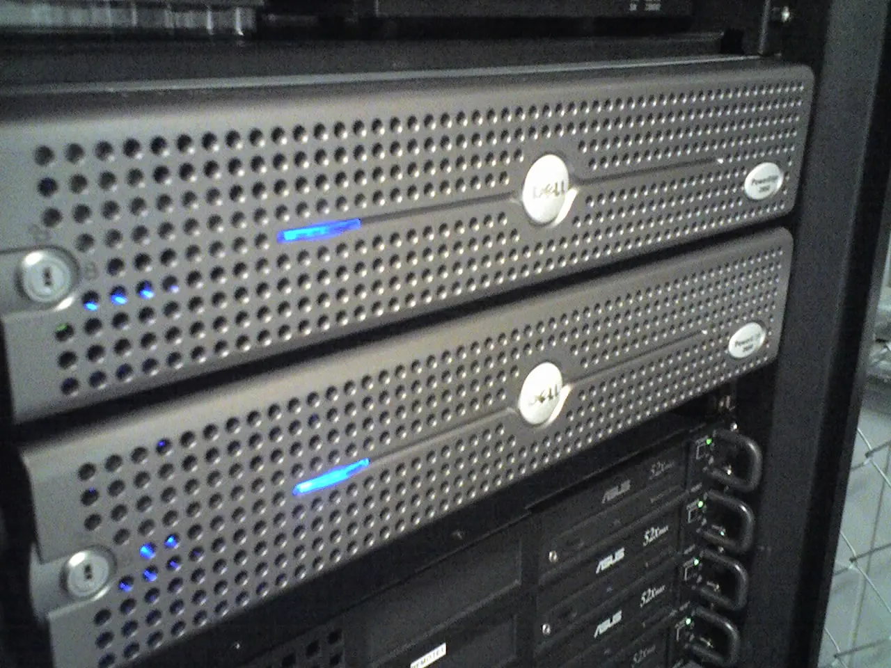 Front panels of Dell PowerEdge servers mounted together in a rack