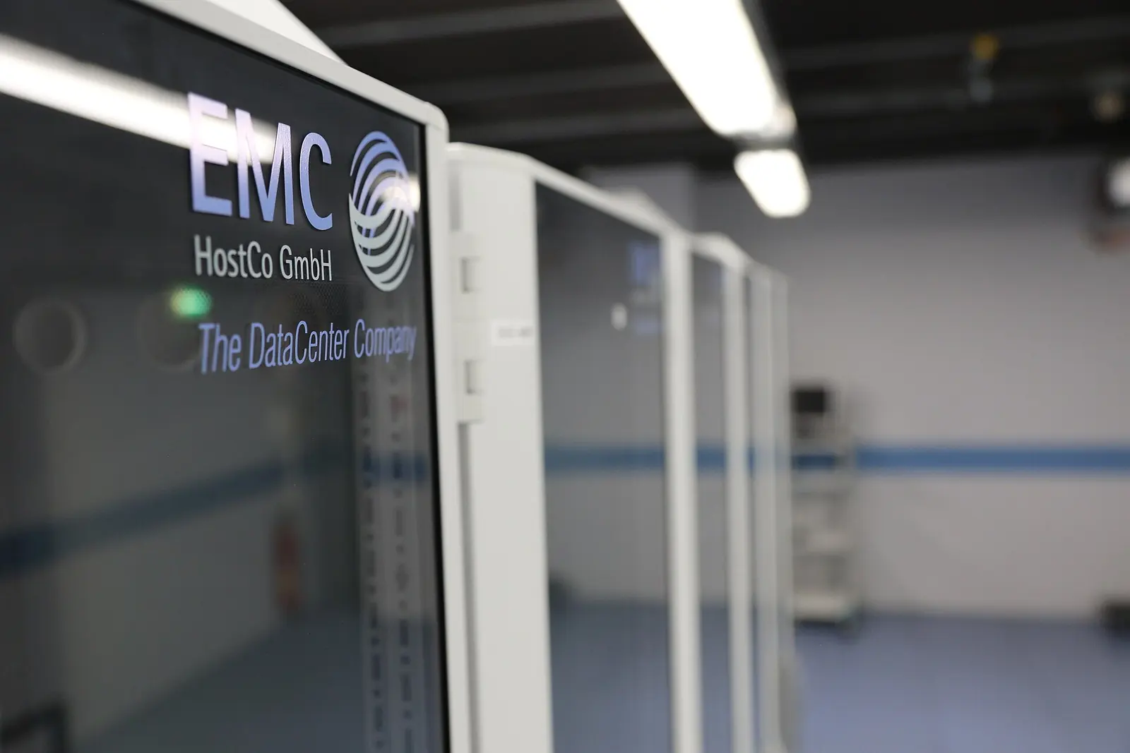 EMC-branded equipment cabinet and neighbouring racks in a data centre
