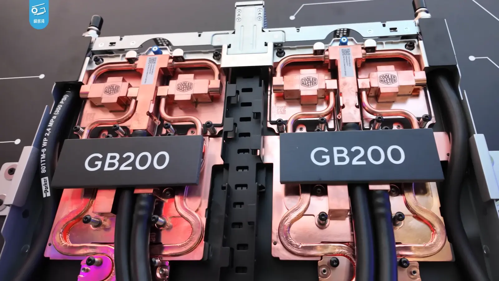A pair of NVIDIA GB200 compute assemblies with liquid-cooling blocks and connected pipes