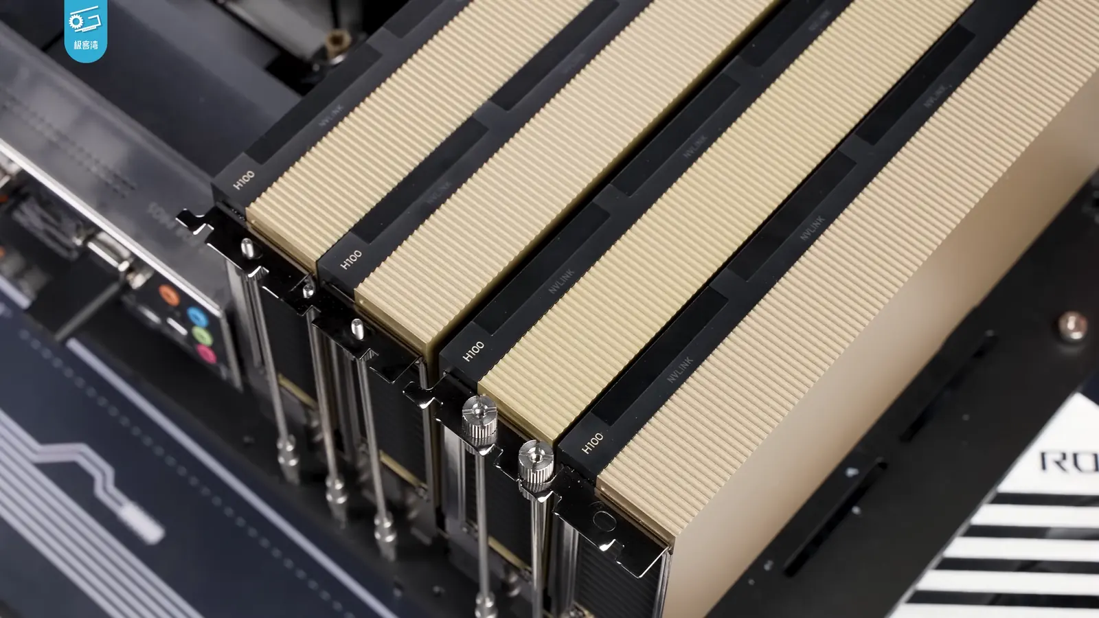 Four NVIDIA H100 GPU accelerators installed side by side in a development system