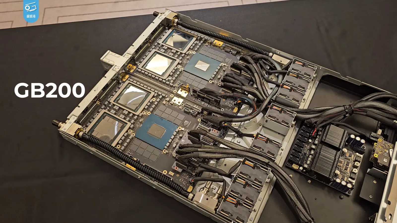 NVIDIA GB200 compute board with processors, liquid-cooling pipes and interconnects on display