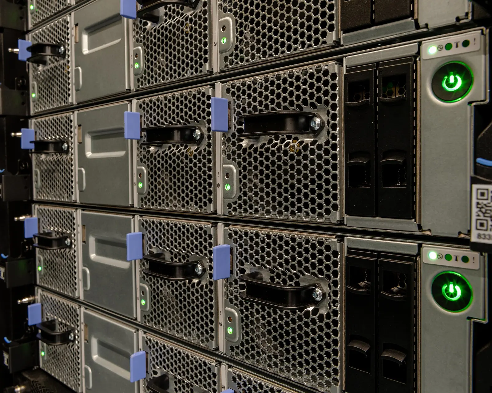 Rack-mounted Summit compute nodes with power indicators and cooling grilles