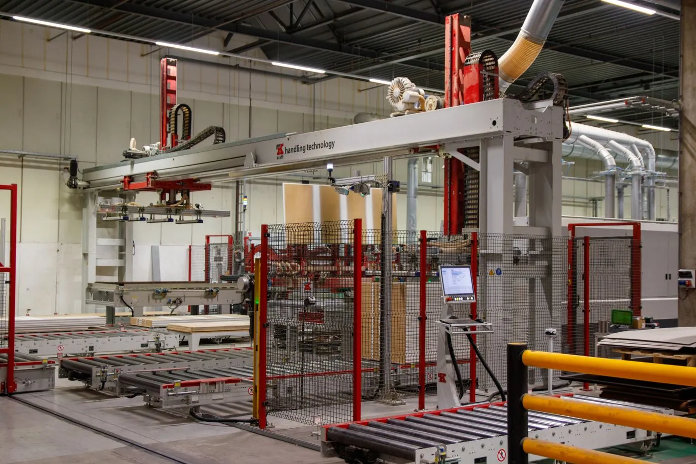 Production equipment and marked work areas on a factory floor