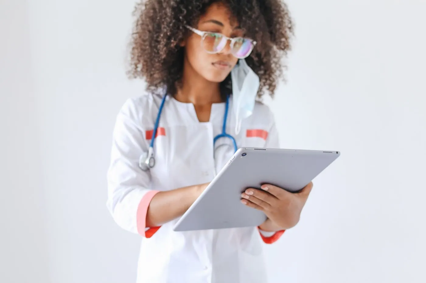 Healthcare professional reviewing information on a tablet